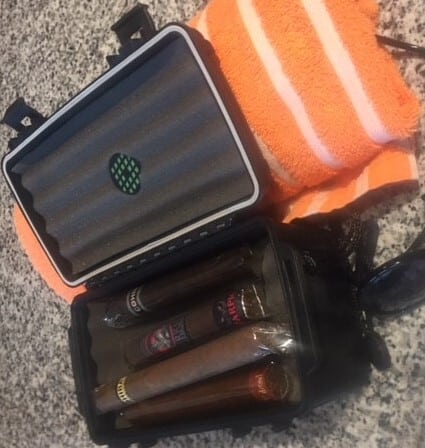 A portable humidor makes traveling with cigars a breeze.