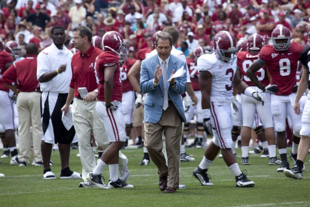 University of Alabama team celebrates win with victory cigars as part of their Alabama cigar tradition.