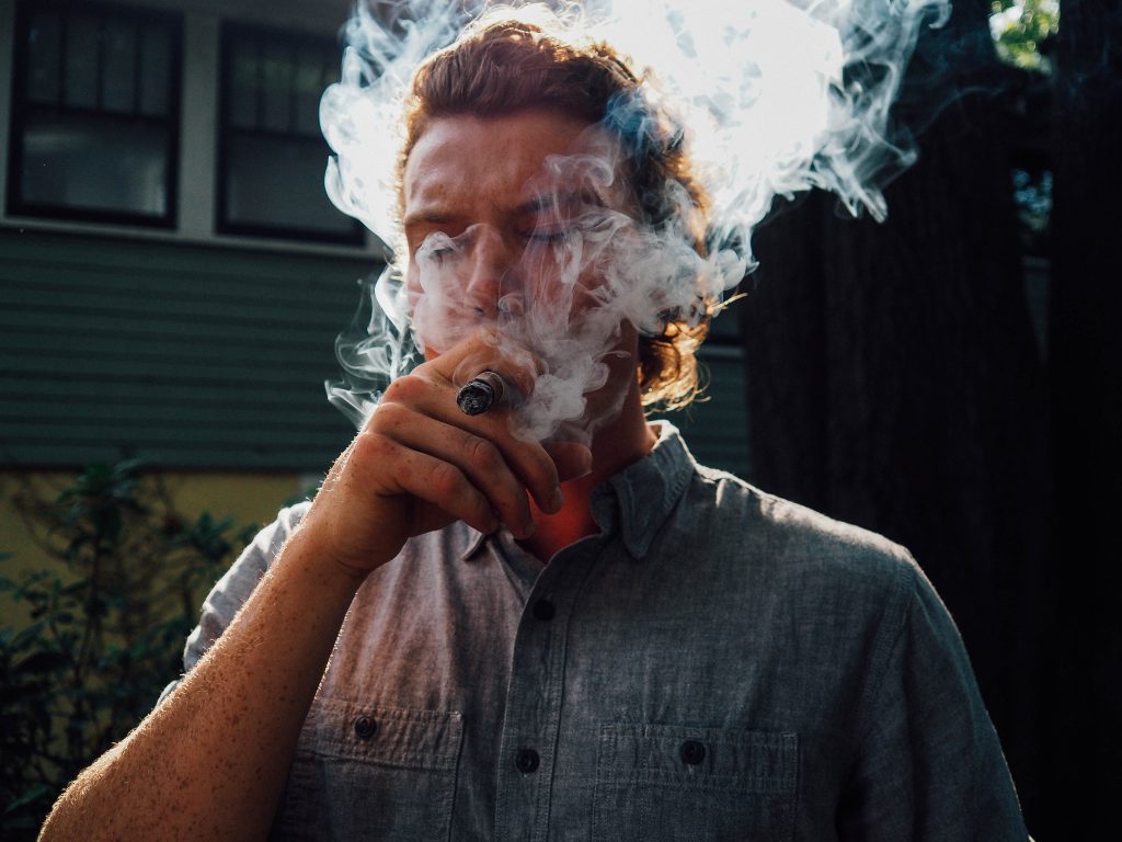 A man enjoying a good cigar