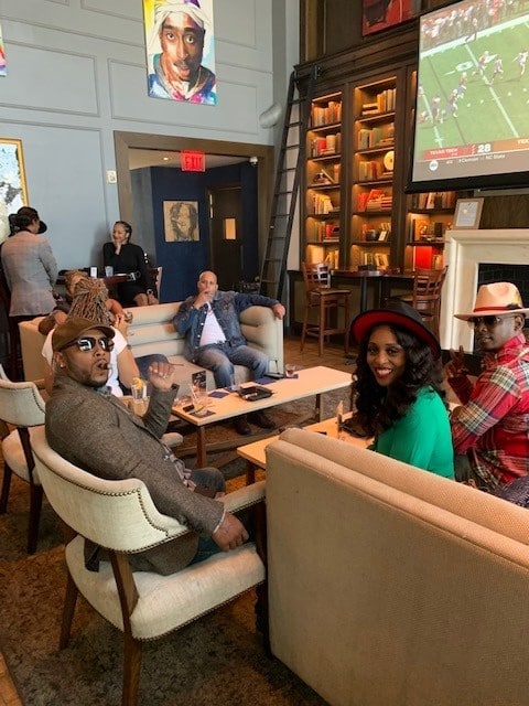 Cigar enthusiasts enjoying a smoke in one of the many cigar lounge communities.