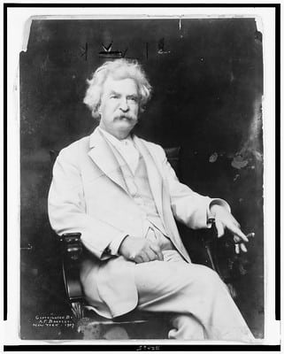 Mark Twain posing with a cigar