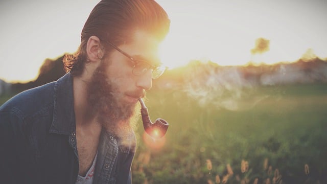 A man smoking pipe tobacco