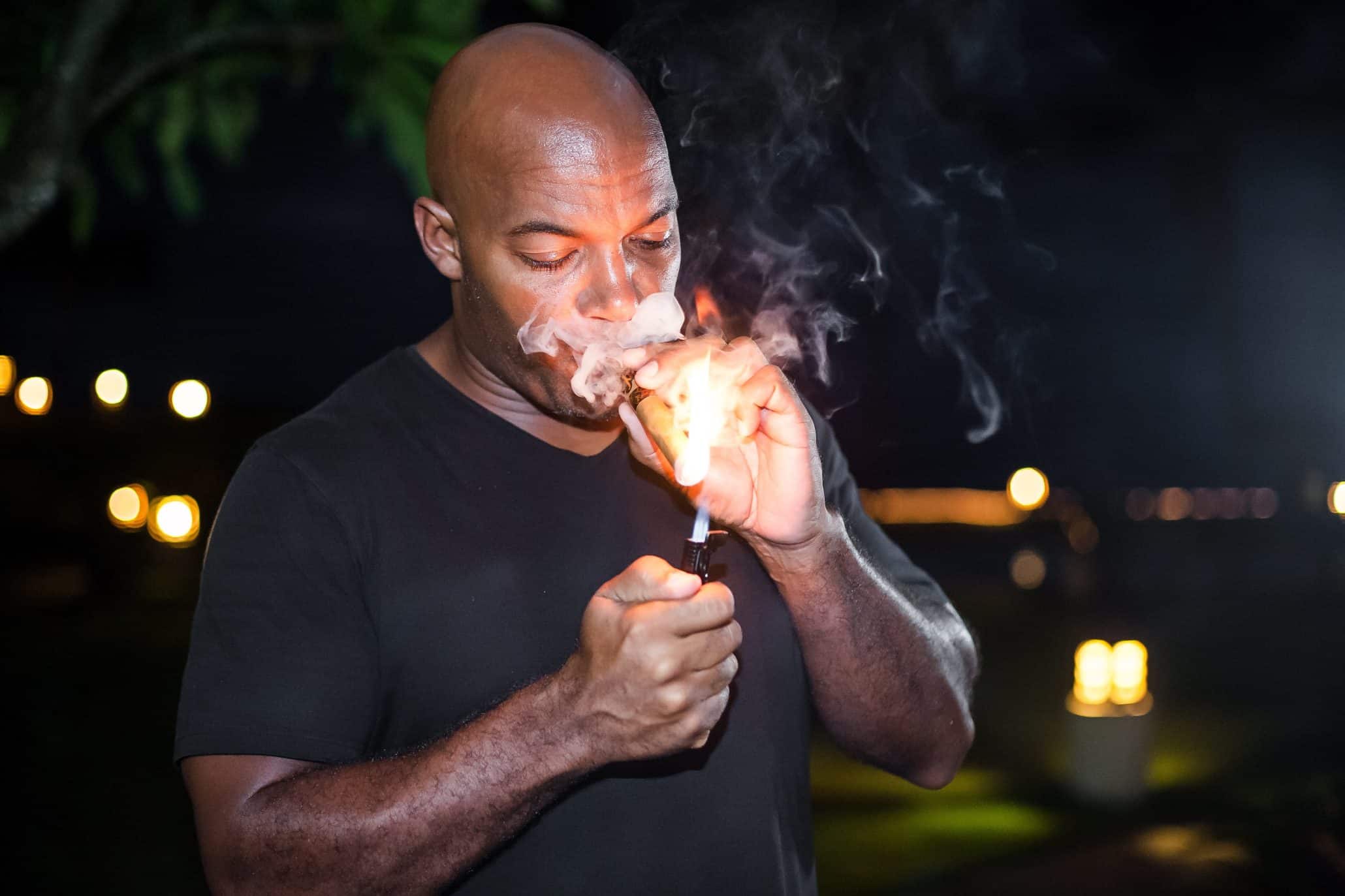Dean Parsons, founder of Epic cigars, lights a smoke.