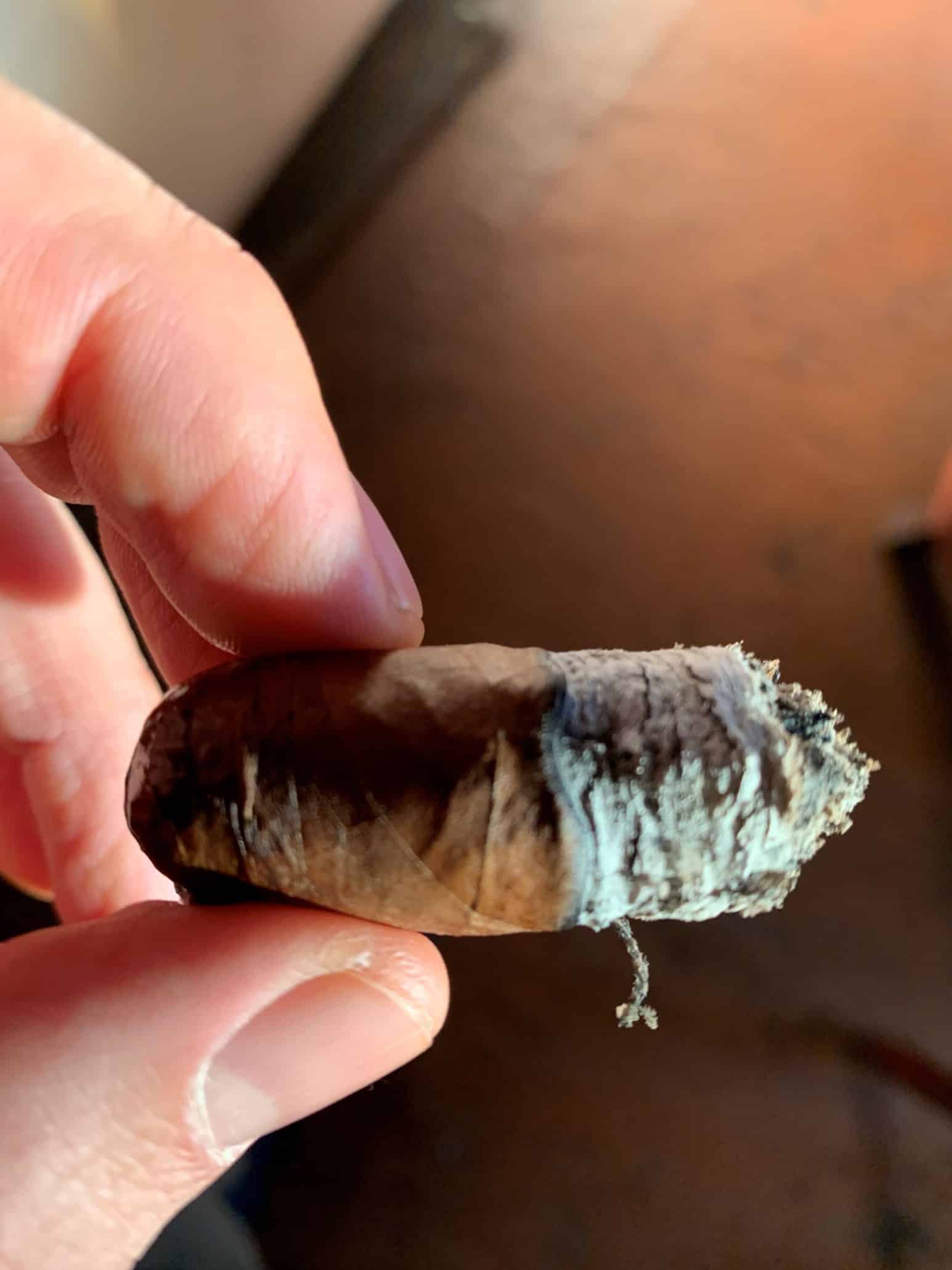 A cigar smoked down to the nub, which can be a pet peeve for some.
