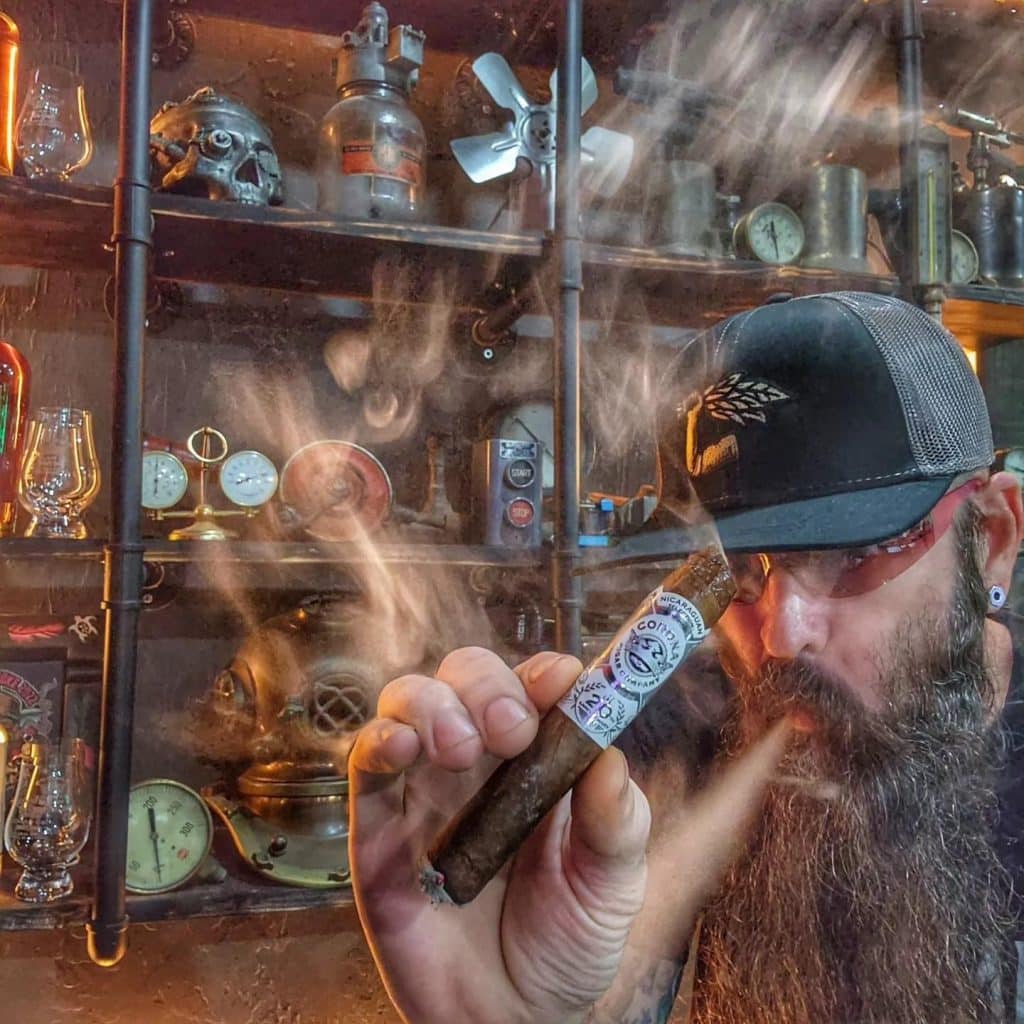 Kevin Shahan, of Cigar Prop, smoking a cigar.