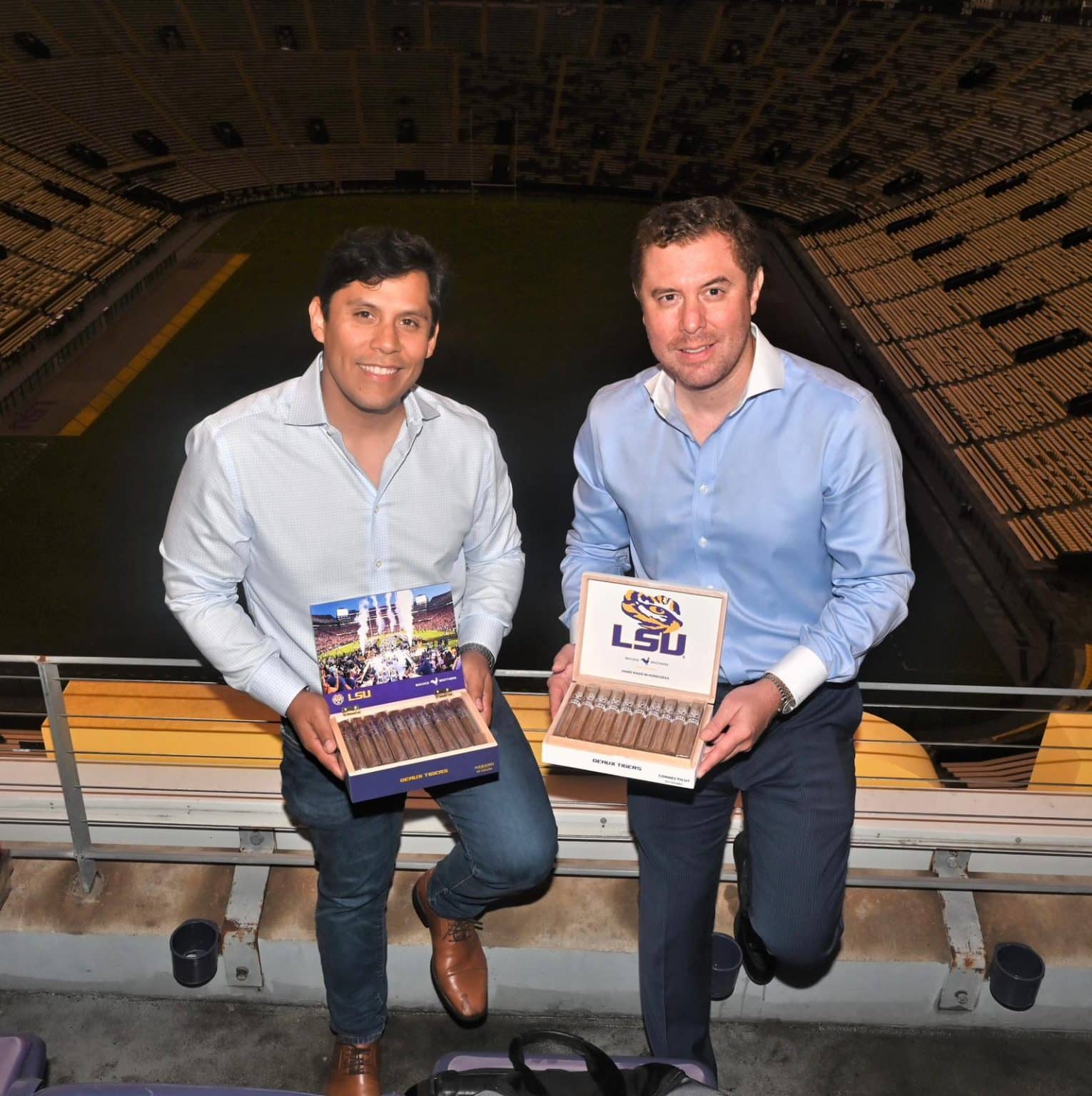 Douglas Bobcock and brother Bryant Bobcock holding a box of Bobcock Brothers Cigars.